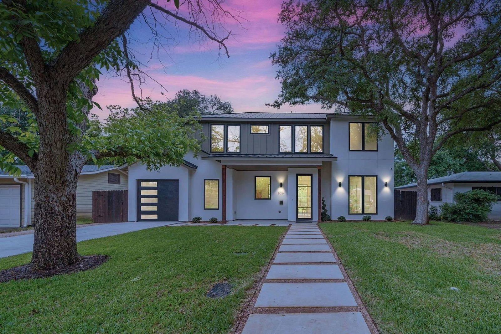 Northern California custom home photographed at twilight with warm interior lighting