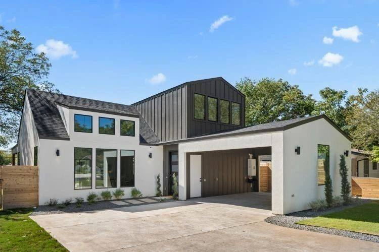 Modern Placer County home elevation in white stucco and dark standing-seam metal