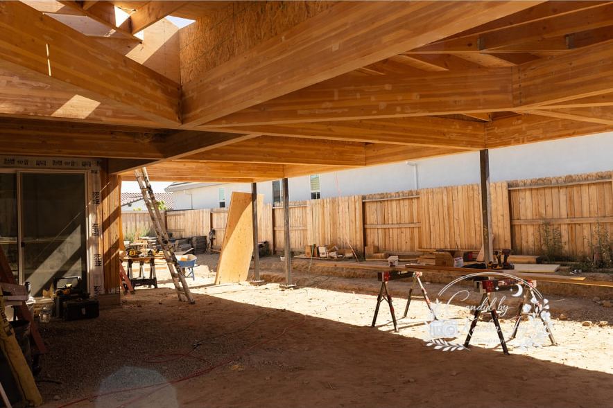Covered patio with stained timber beams on a Lane Built home in Placer County
