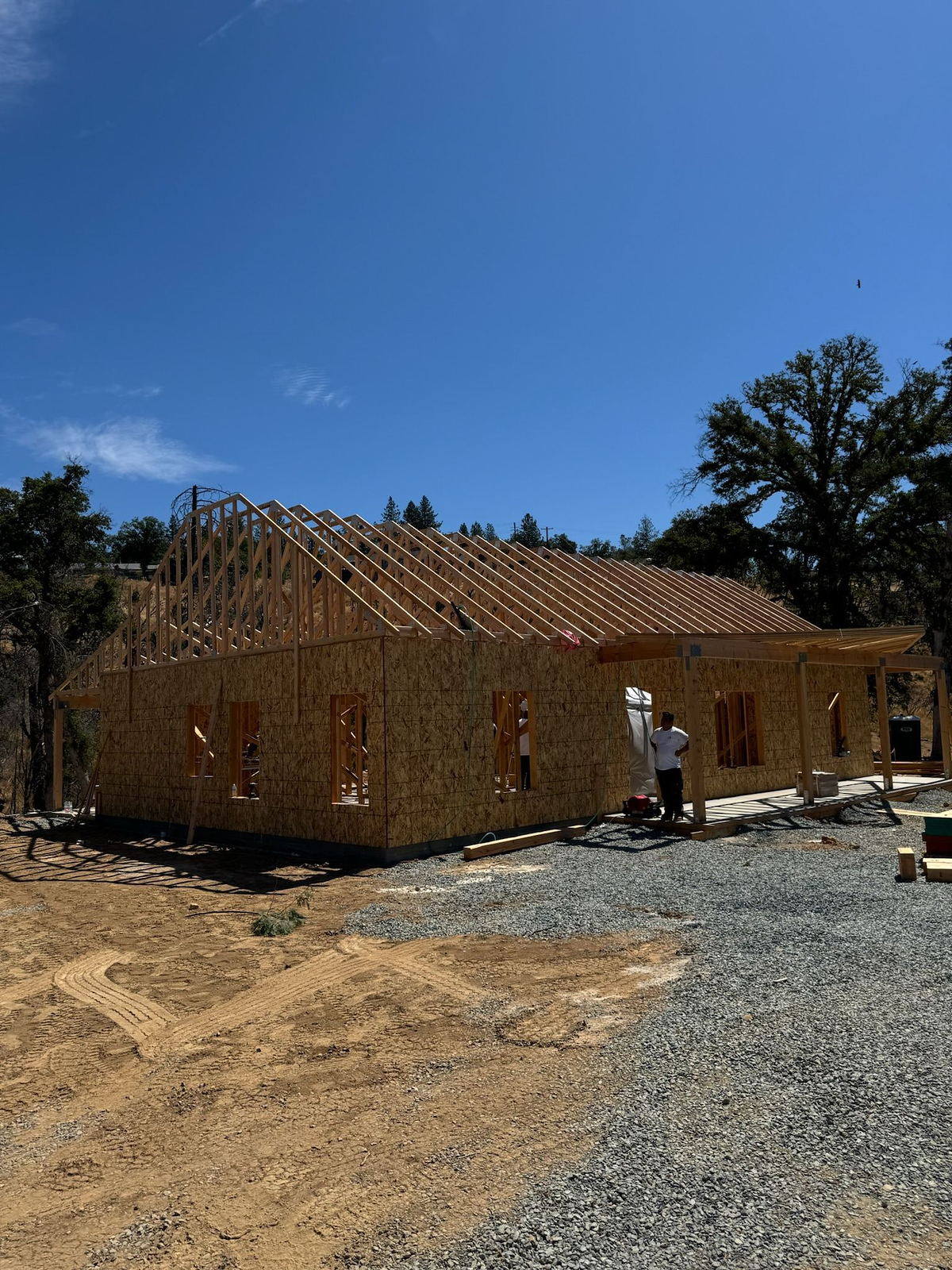 Roof trusses set over a framed Lane Built custom home